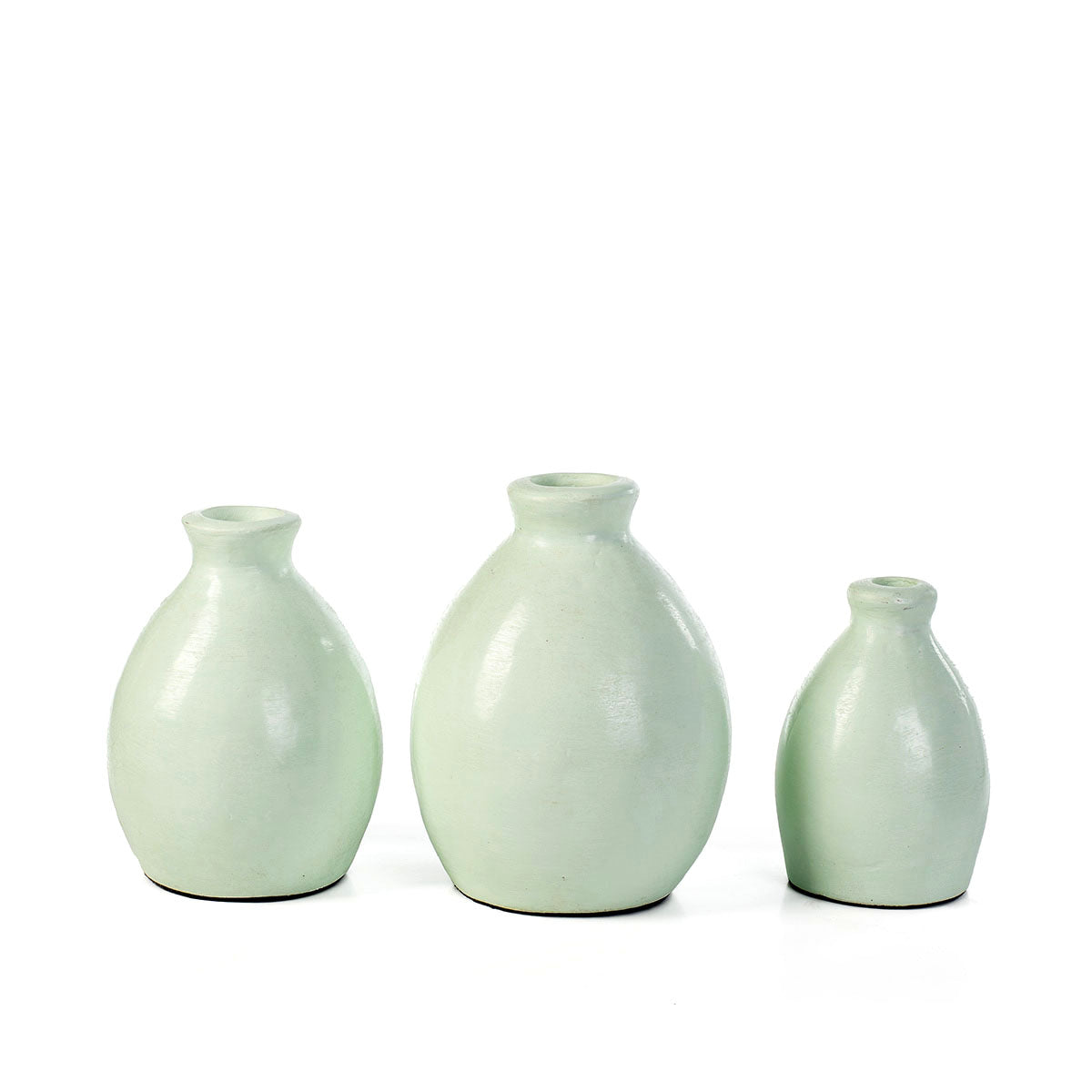 A set of three reseda green ceramic decorative vases with simple shapes on a white background.