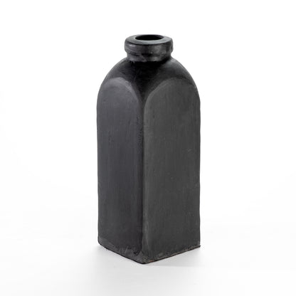 A tall, black ceramic decorative vase with a narrow neck and a rounded base.