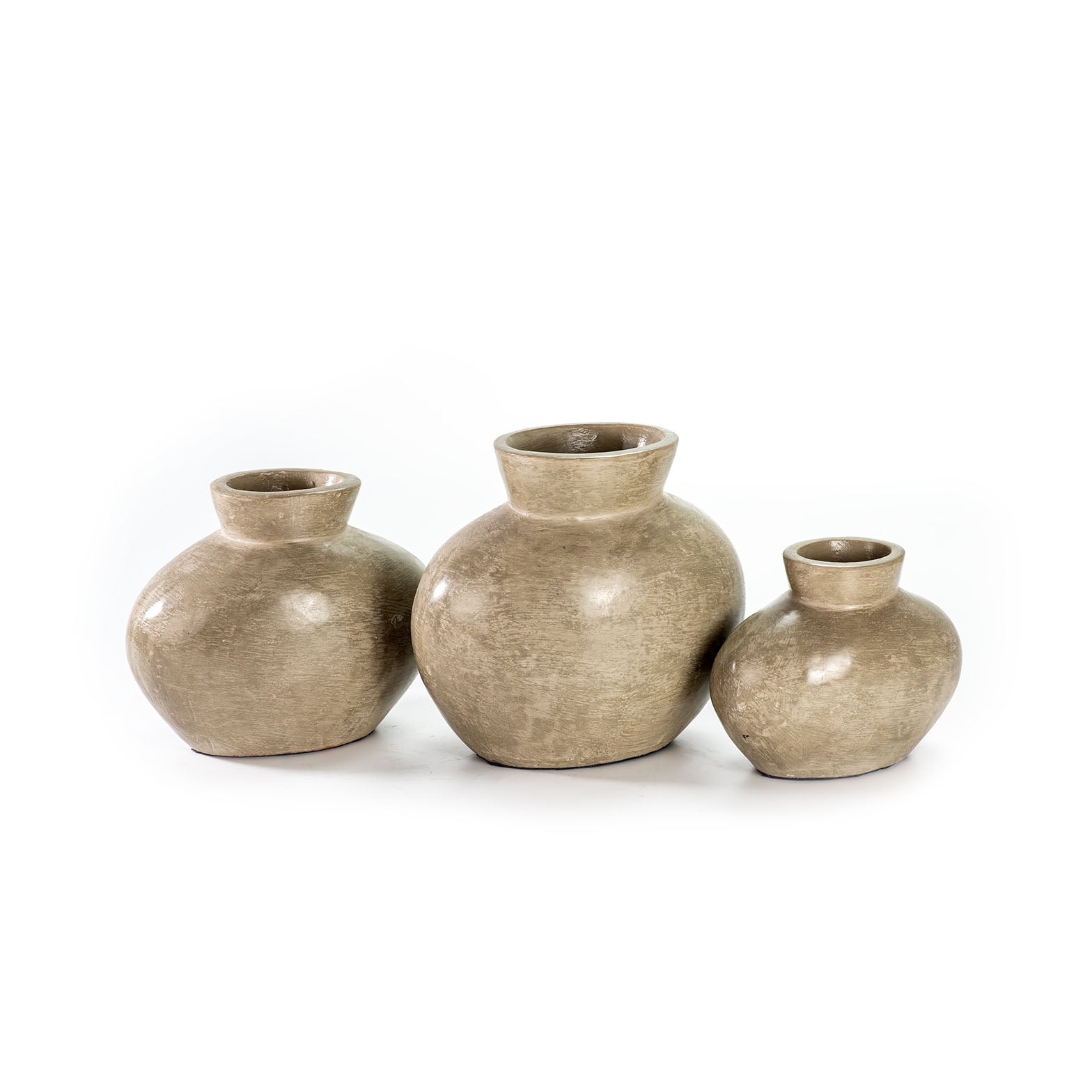 Three beige ceramic decorative vases with a smooth, textured surface, three different sizes. 