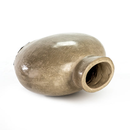 A beige ceramic decorative vase with a smooth, textured surface.