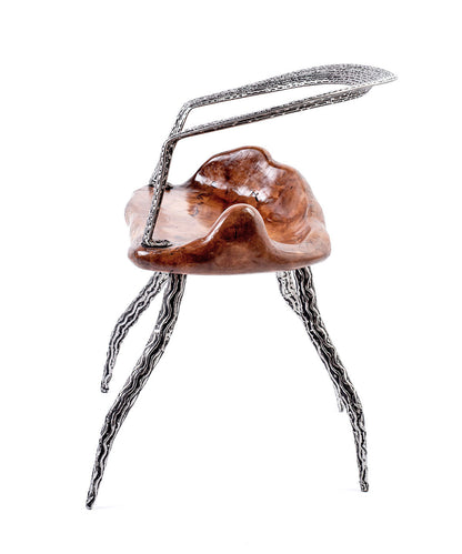 An artistically designed dining chair with a glossy finish on a white background. The chair features a teak wood seat and stainless steel legs with a relief longitudinal structure. Side view. 