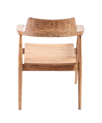 A dining chair made of teak wood with a natural color, featuring a full backrest and seat, with visible grain and imperfections.