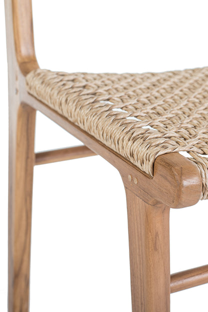 A beige dining chair with a seat and backrest made of woven rope, and a frame made of polished teak wood.