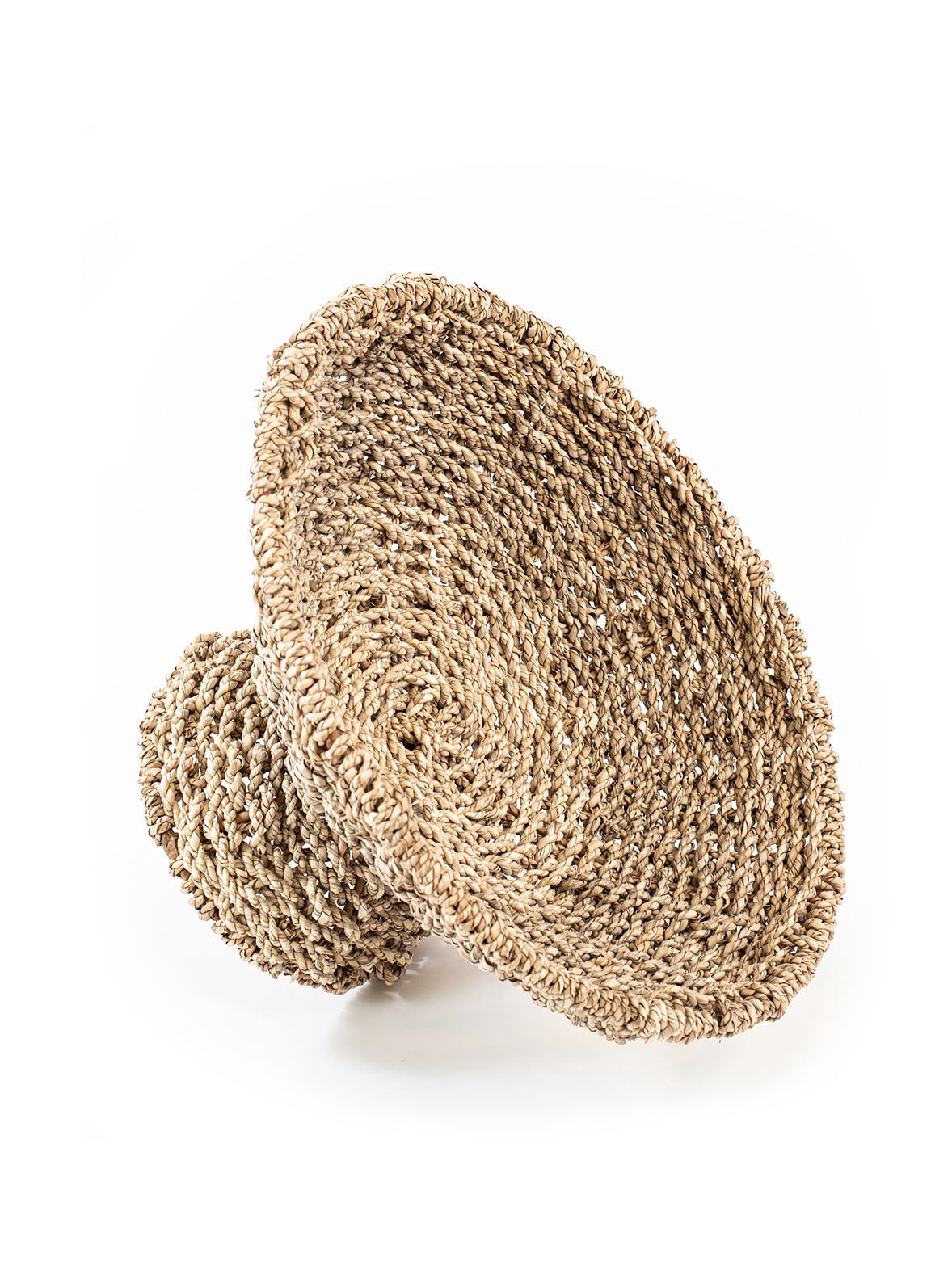 Hand woven fruit basket in natural color, made from seagrass. 
