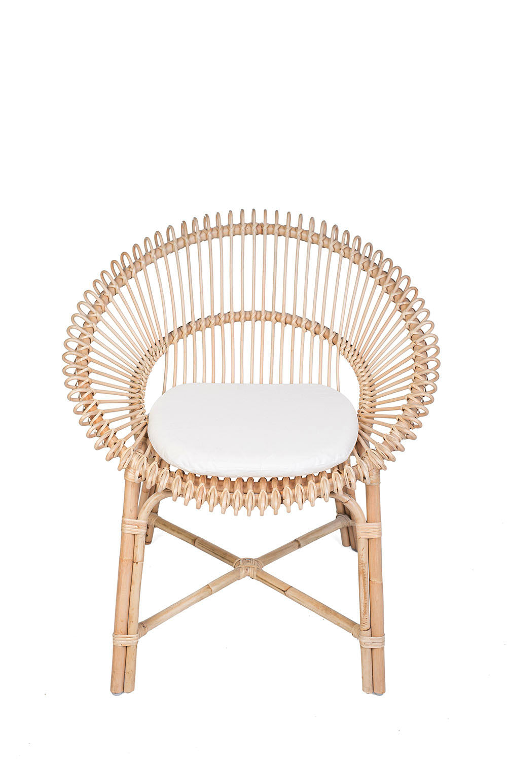 Wicker chair with a white cushion on a white background