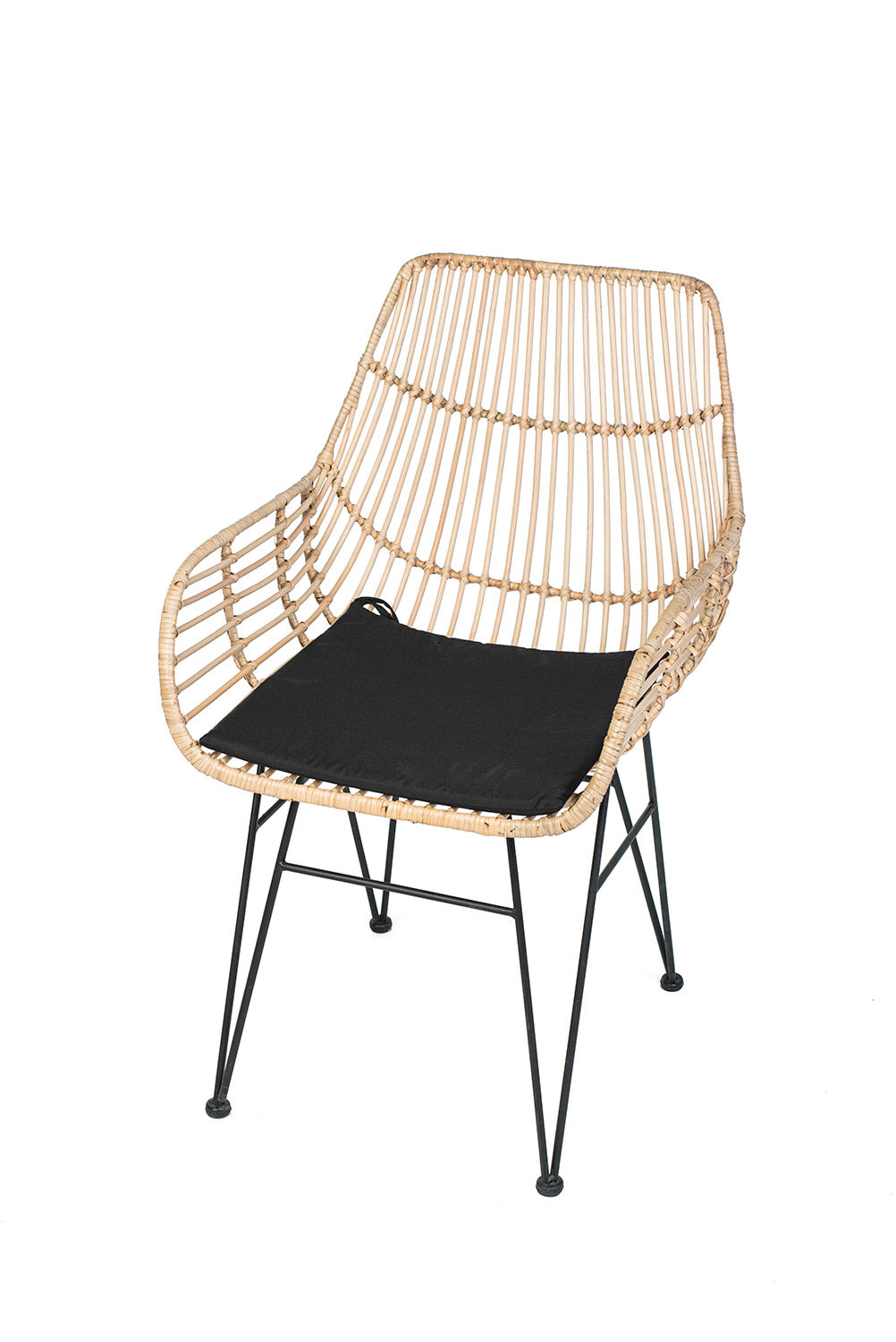 A lounge chair with a black iron frame, natural color woven rattan and black  seat cushion.