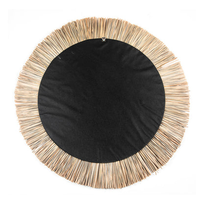 A round mirror with a natural seagrass frame, featuring a layered design with beige and white stripes.