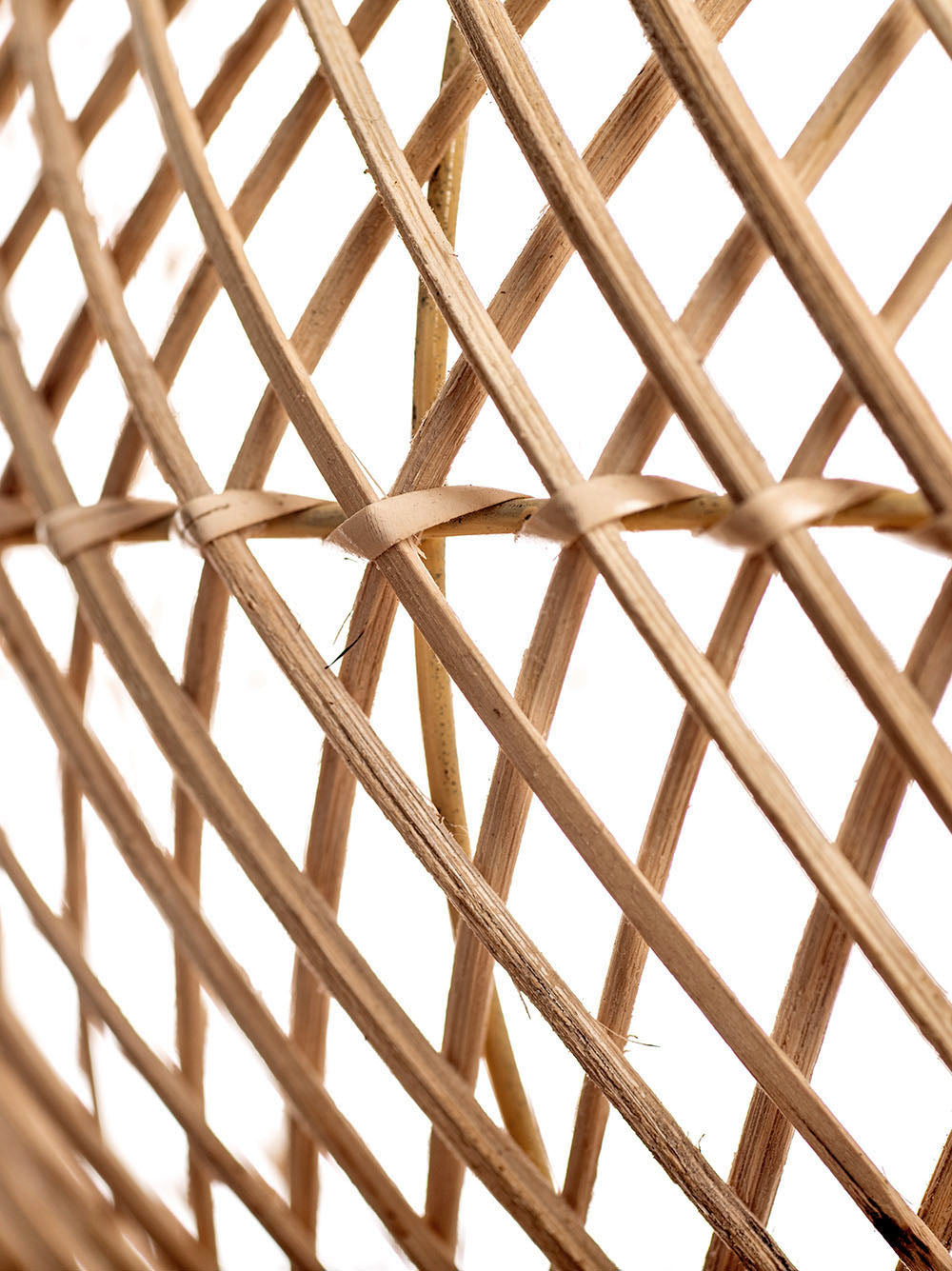 A natural color rattan pendant lamp with a teardrop shape and a wooden top.
