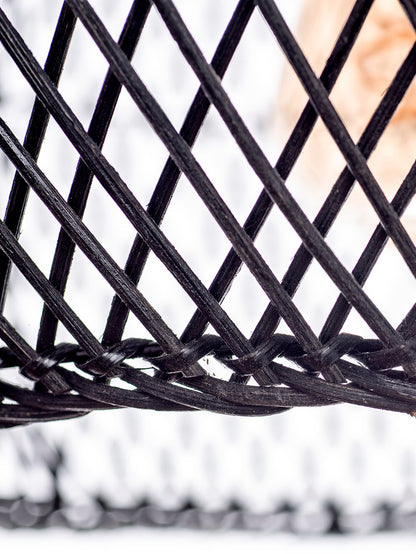 A black color rattan pendant lamp with a teardrop shape and a wooden top.
