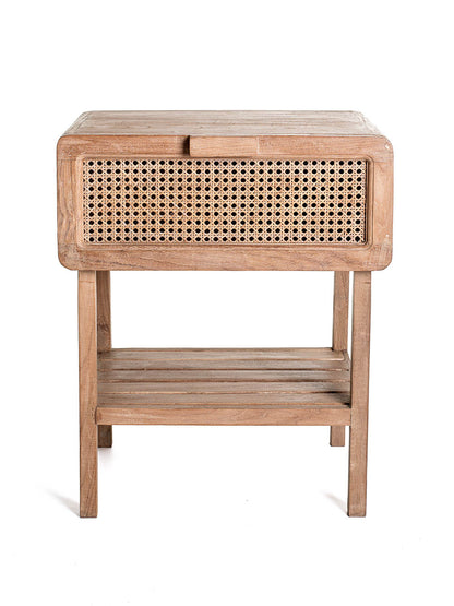 A small one-drawer teak wood side table with rattan netting on the front and a lower shelf, set against a white background.